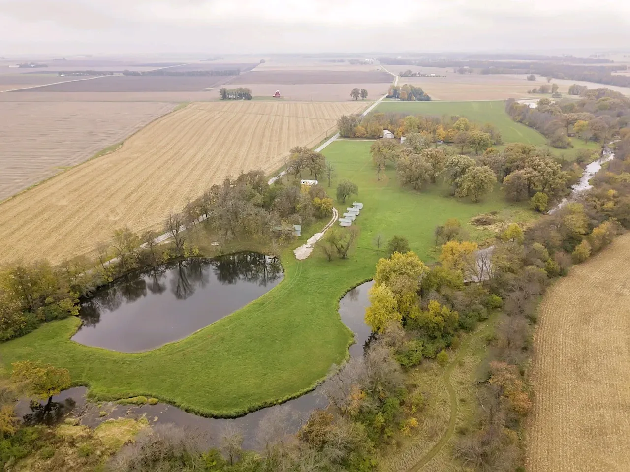 Aerial view of Camp Ziegenhorn showing cabins, pond, and wooded grounds in Central Illinois